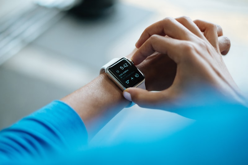 Healthcare professional reviewing patient vitals